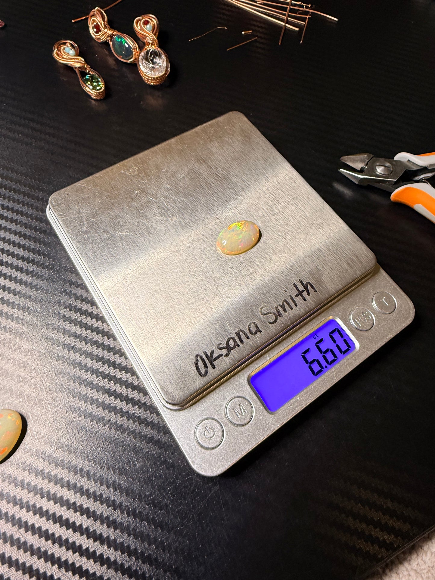 Ethiopian Welo Opal 6.60 Carats in polished copper with orange garnet & quartz accents.