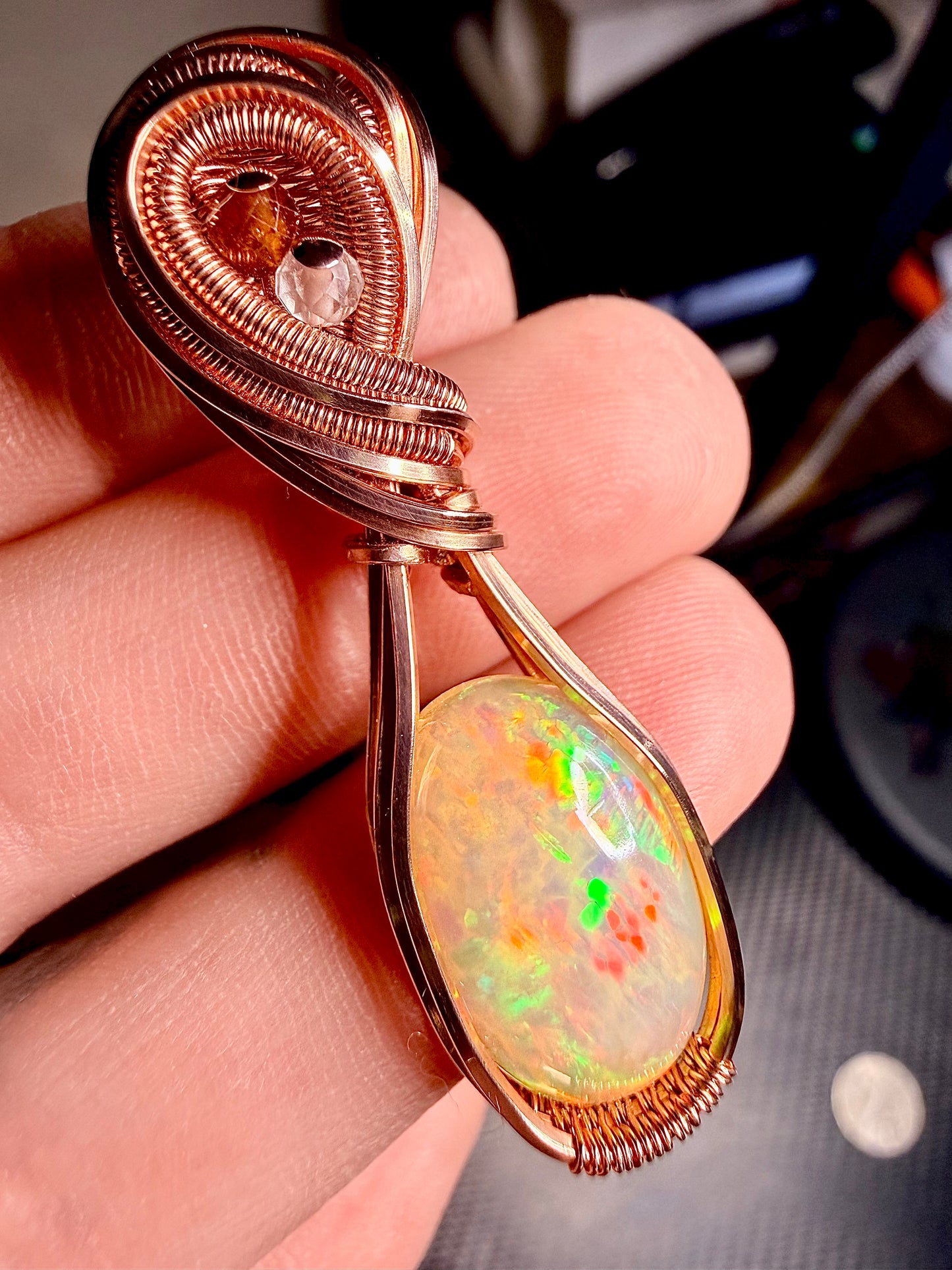 Ethiopian Welo Opal 6.60 Carats in polished copper with orange garnet & quartz accents.